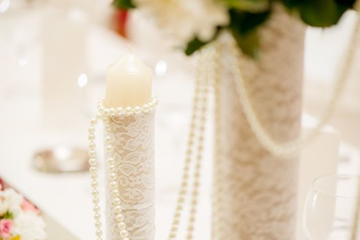 Close-up of a wedding table decoration with candle