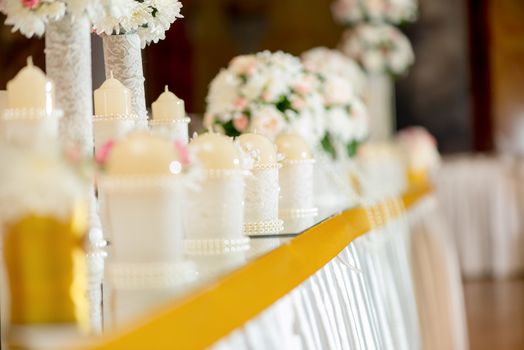 Wedding table decoration with flowers and candle