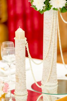 Wedding table decoration with candle and glassware