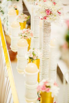 Wedding table decoration with candle, flowers and glassware