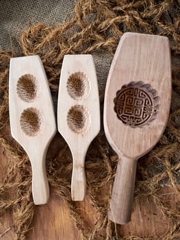 close up of rustic oriental wooden mooncake mold