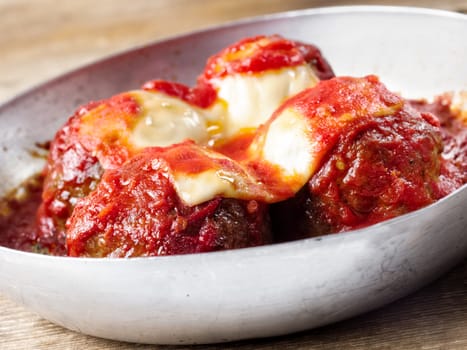 close up of                     traditional classic italian meatball in tomato sauce