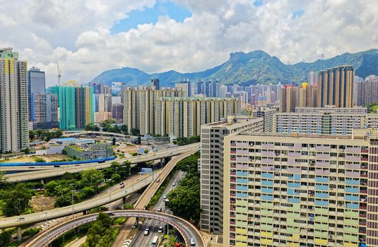 hong kong public estate buildings with landmark lion rock at day