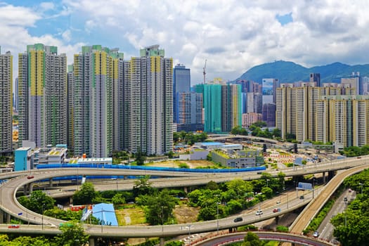 hong kong public estate with landmark lion rock at day