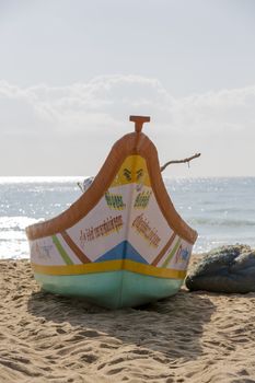 Pondichery, Tamil Nadu, India - February 27, 2014 : Traditional fishermen on beach, on sea, on sand. Long boats, Hard work poor people