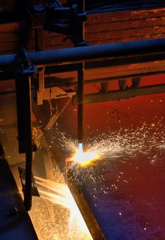 Gas cutting of the hot metal steel plate
