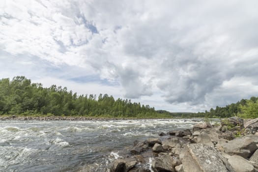 River with Forest and Cloudy Sky.