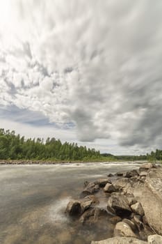River with Forest and Cloudy Sky.