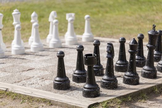 Chess Lawn Game with grass in the background.