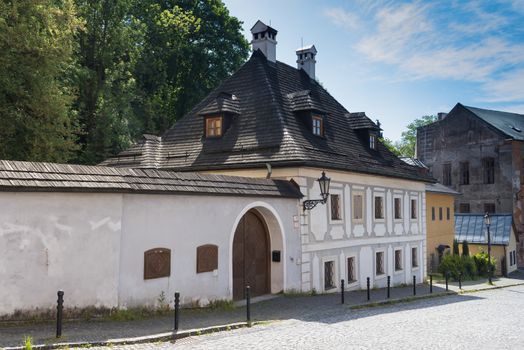 Street in Banska Stiavnica, former mining city, which is in the UNESCO World Heritage list. Calm summer morning.