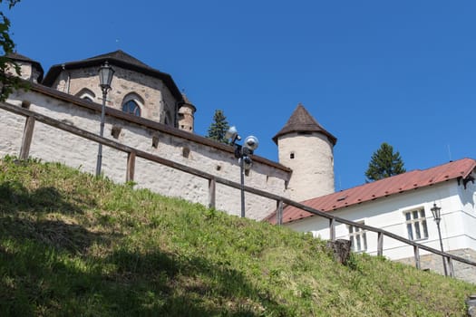 Part of a fortification of the Old Castle in the city Banska Stiavnica, Slovakia. Summer blue sky.