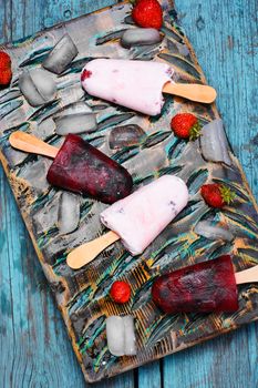 Ice cream on the kitchen chalkboard and berries fresh strawberries