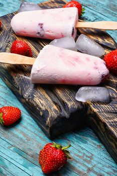 Ice cream on the kitchen chalkboard and berries fresh strawberries