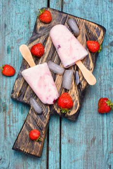 Ice cream on the kitchen chalkboard and berries fresh strawberries