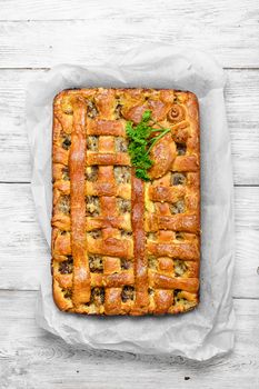 Fragrant meat pie on parchment.View from the top