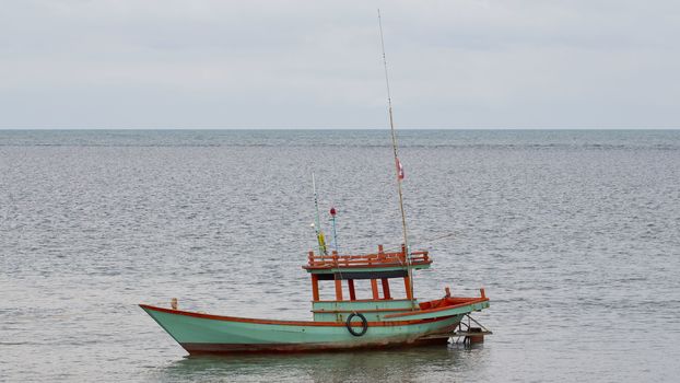 Alone Fishing Boat in a sea.