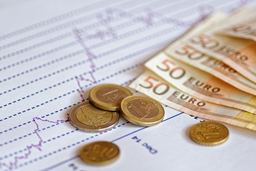 finance and statistics, euros, coins, graph, still life