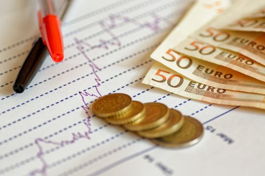 finance and statistics, euros, coins, graph, still life