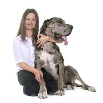 Great Dane and teenager in front of white background