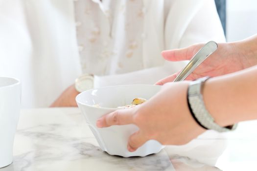 carer bringing meal to senior,meal time
