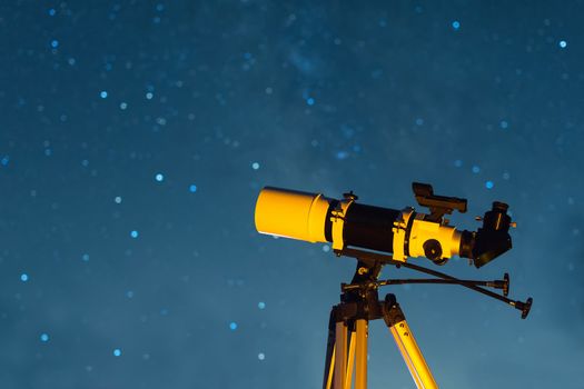 Astronomical Telescope Pointed at the Starry Sky in the Night