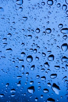 rain drops on a window glass. Shallow DOF