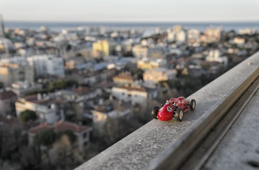 Model of famous historical car of the 50's from the window of a skyscraper