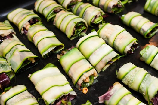 cabbage rolls with vegetables on platter prepared for fry