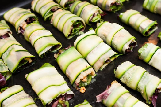 cabbage rolls with vegetables on platter prepared for fry