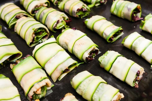 cabbage rolls with vegetables on platter prepared for fry