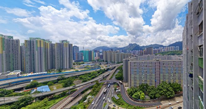 hong kong public estate buildings with landmark lion rock at day