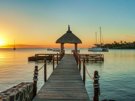 Romantic colorful sunset view with landing stage