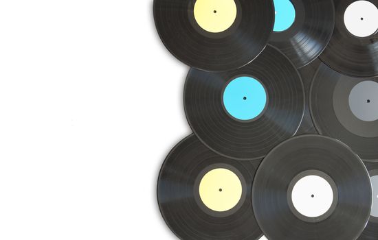 Vinyl records on top of a white background with space