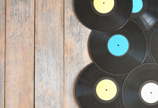 Vinyl records on top of wood with space