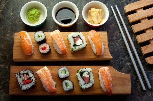 Selection of sushi including prawns, salmon and vegetables with rice