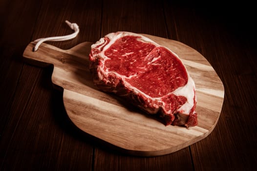 Entrecote steak of beef on a wooden board, studio shoot