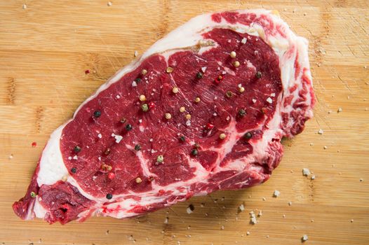 Entrecote steak of beef on a wooden board, studio shoot