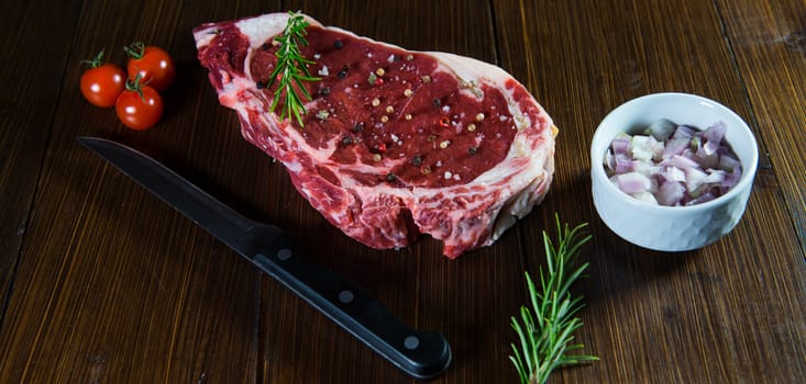 Entrecote steak of beef on a wooden board, studio shoot