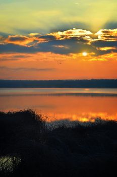 Sunrise over the lake early in the morning with beautiful clouds.