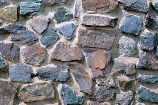 The texture in the form of a wall of colored quartz.
