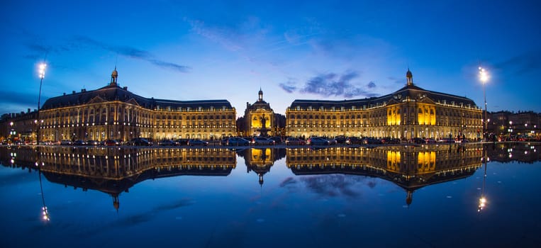 Bordeaux, France, Illuminated Reflection In Water At Place De La Bourse Against Sky