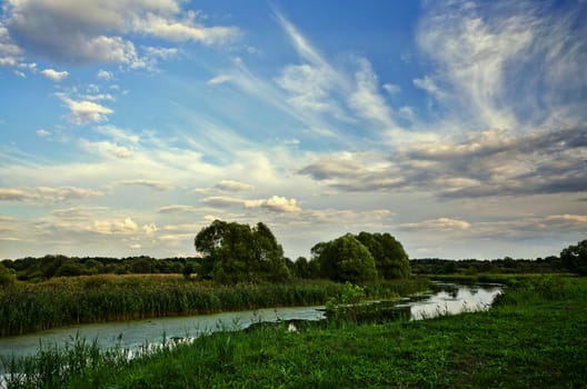 Summer landscape with a river and sky