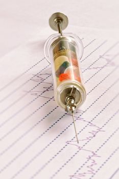 pills and injection needle, graph