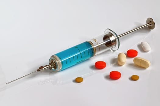injection needle with medicine and pills