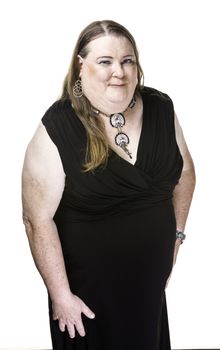 Transgender woman in black dress posing over white background