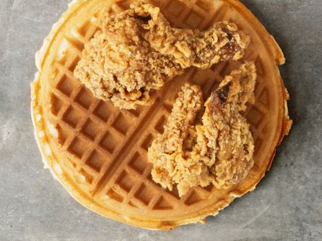 close up of rustic southern american comfort food chicken waffle