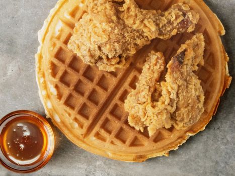 close up of rustic southern american comfort food chicken waffle