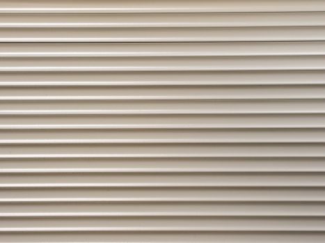 white metal roller shutter from shop door