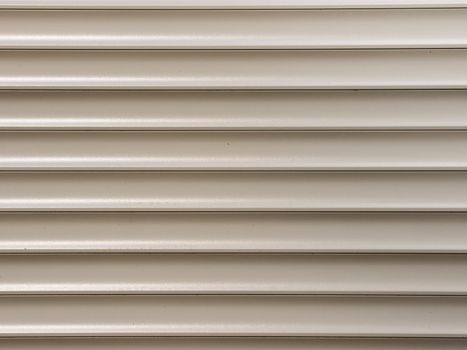 white metal roller shutter from shop door