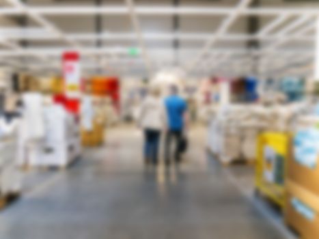 People shopping Home decor in department store. Blur store with bokeh background